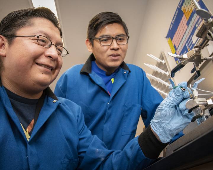 Two Native American researchers in a laboratory