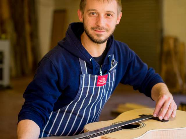 Chris in his workshop building a guitar. 