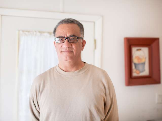 Gene Ray photographed in his home.