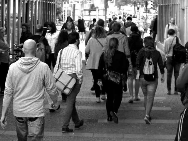 A black-and-white photo of a crowd of young people. Pexels stock photo.
