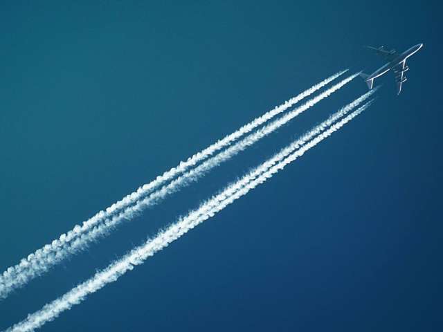 A photo of a jet plane and its contrails. Pexels