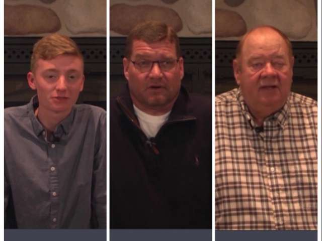 Three generations of farmers sit next to each other. 