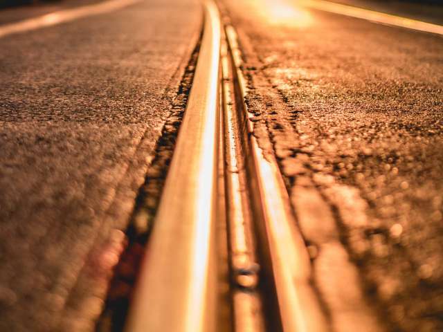 Close-up view of asphalt on a hot summer day.