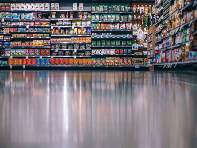 A shiny floor in a small grocery store.