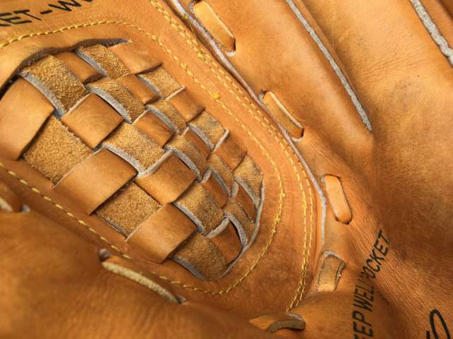 A close-up view of the inside of a baseball glove. 