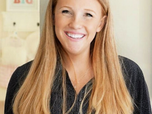 Ali has long, light brown hair and black top on.