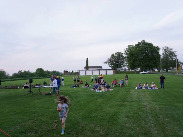 Group gathering on a lawn for an event