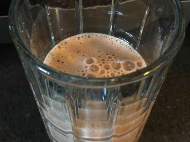 A chocolate milkshake in a glass. Stock photo