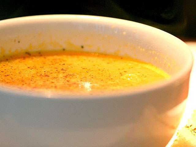 A close-up view of a creamy bowl of soup. 