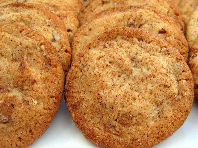 A close-up view of fresh-baked cinnamon cookies in a row. 