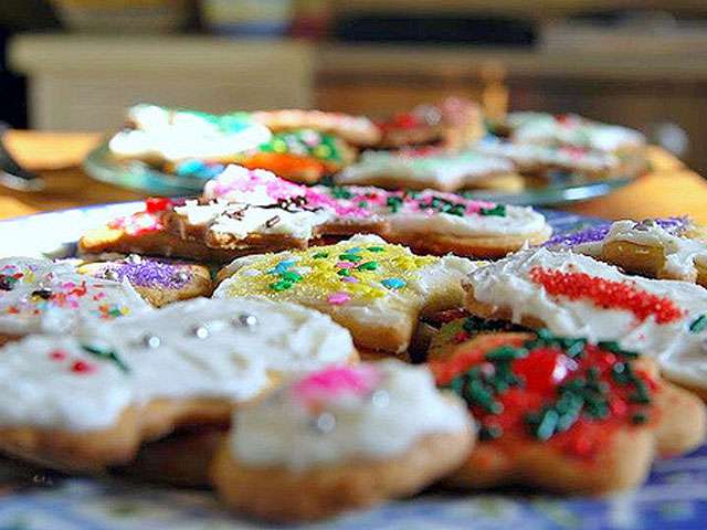 A plate full of cookies, covered with colorful icing and sprinkles. Photo by Ben Murray. Flickr Creative Commons. Attribution-Non-Commercial. 