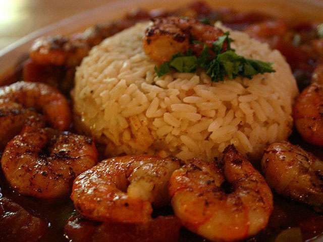 A plate full of shrimp and rice.