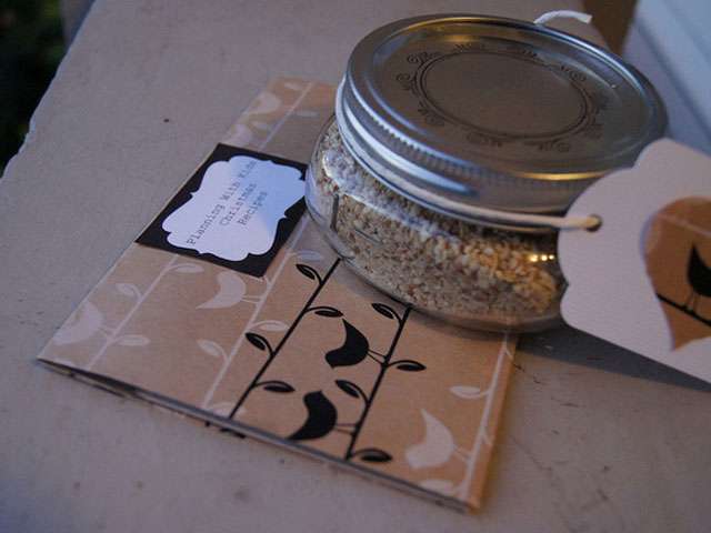 A jar of food resting on top of a recipe card. 