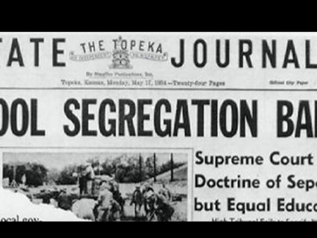 The front page of a 1966 local newspaper that reads, School Segregation Banned.