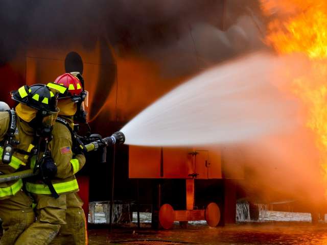 Firefighters battle a raging blaze. 