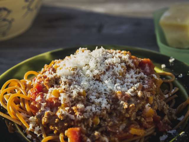 A bowl full of spaghetti noodles, sprinkled with cheese. Pexels stock photo