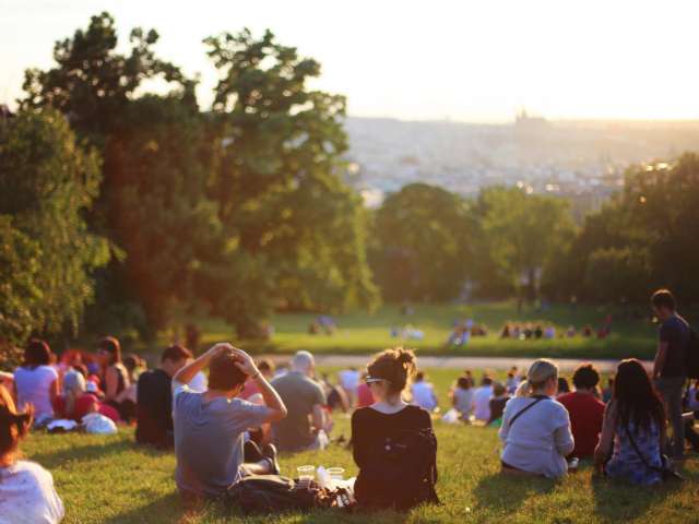 A group of people gather outside to hear a concert. Pexels stock photo