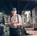 Glenn Bolick holds a piece of his pottery. 