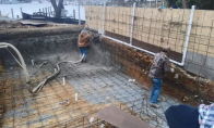 Creating a silt fence around a pool. 